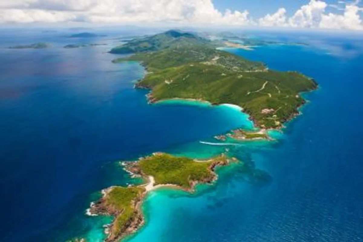 Aerial view of St. Thomas and St. John islands and turquoise reefs seen while parasailing over Sapphire Beach in the U.S. Virgin Islands